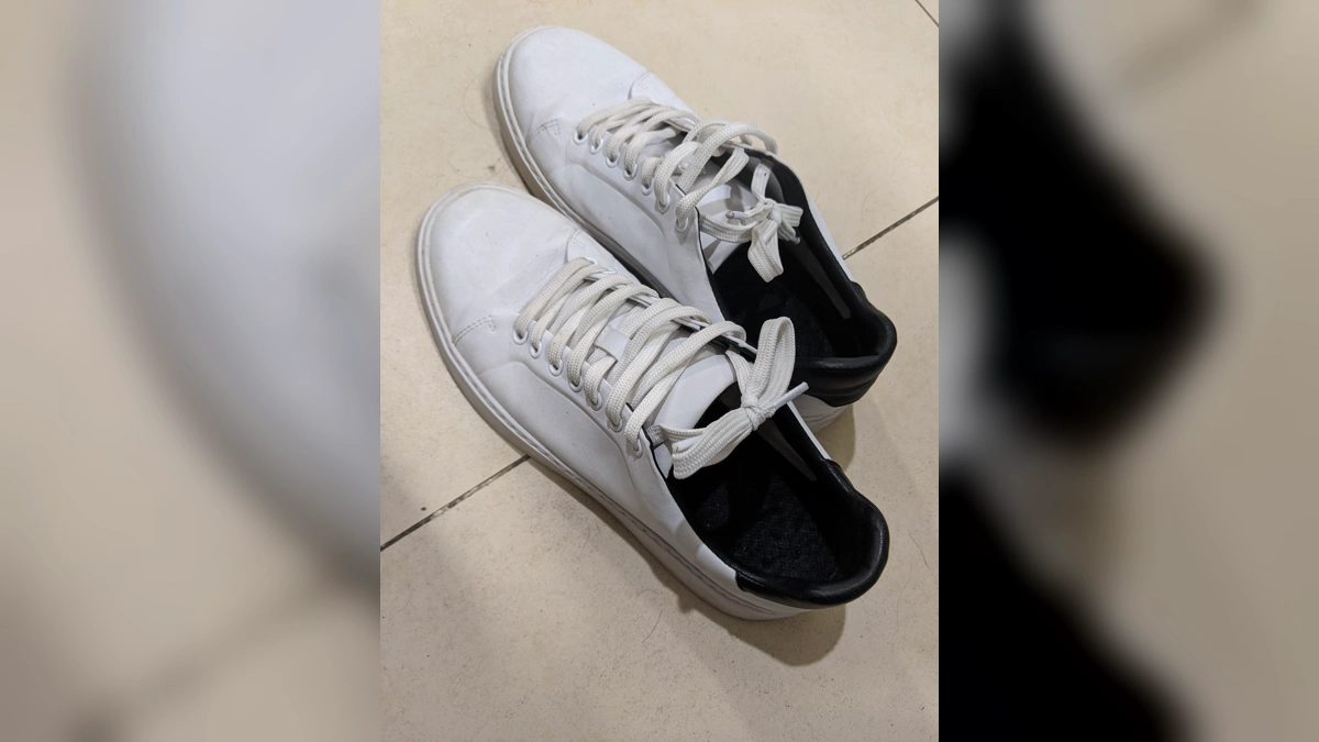 Broken-In Low-Top Sneakers for Convention Days pair of broken-in white low-top canvas sneakers suited to long convention days on hard floors