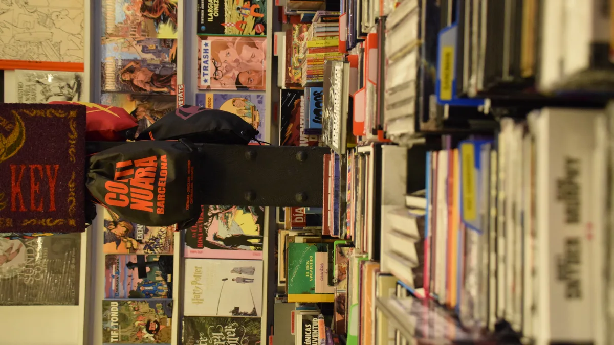 specialized comic bookstore shelves organizing serialized graphic novels and international translated editions