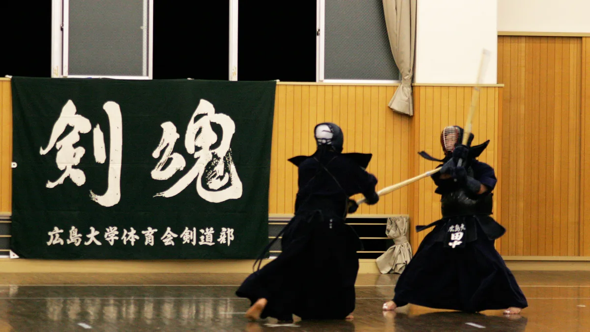 Japanese kendo martial arts club practice demonstrating junior and senior student training