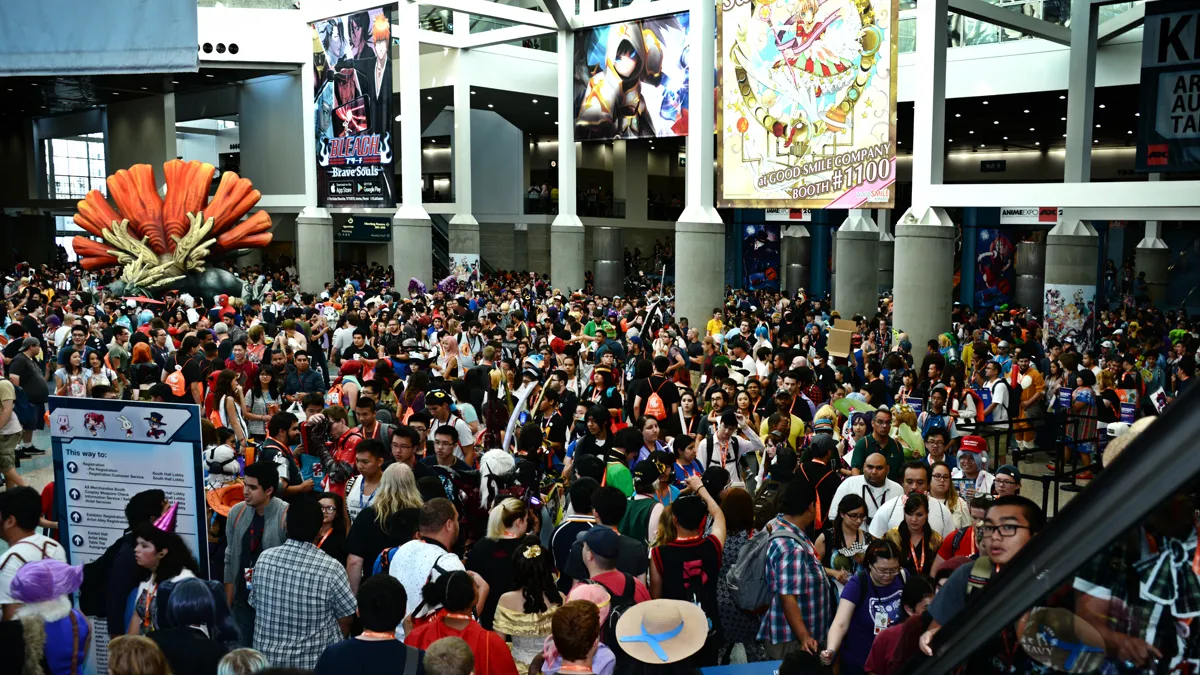 Anime Convention Lobby Crowd in Street Clothes what to wear to an anime convention shown by a casual-dressed crowd in a convention center lobby